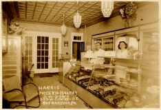 Same Harris and daughter Bessie behind the counter in Harris Bakery circa 1933